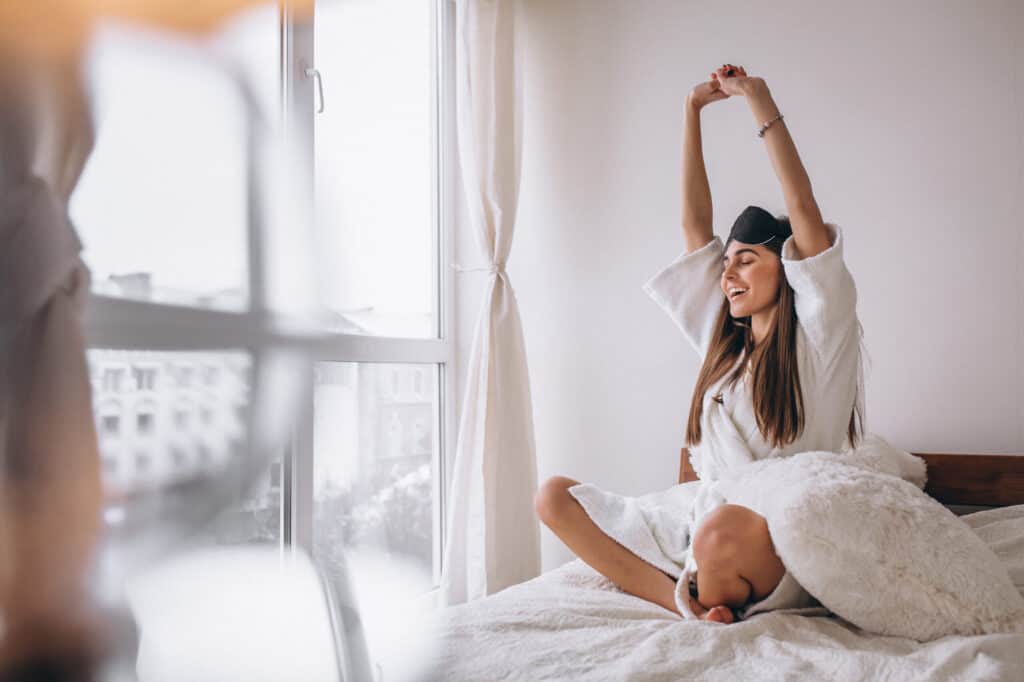 woman bed wearing sleeping mask scaled 1